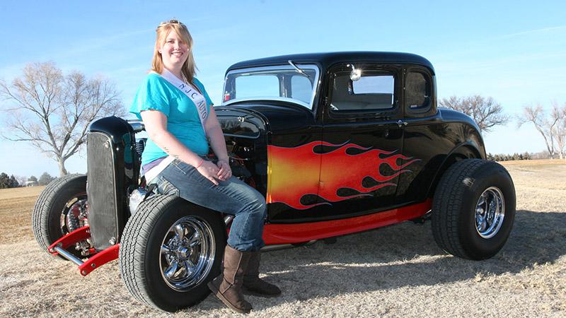Lauren Hegstrom of Arvada is ready to do her duties as the 2011 Auto Show Queen. She’s shown here with a 1932 Ford five window coupe owned by Roger and Cherie Brungardt. The car was chosen as the “best engineered” entry for the NJC show several years ago.