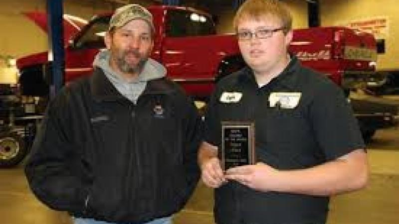 Logan Ward (right) of Atwood, a second year student in the automotive technology program at Northeastern Junior College, has been named the NAPA Student of the Month for November. Presenting the award Aaron Hettinger, outside salesman for the NAPA store. 