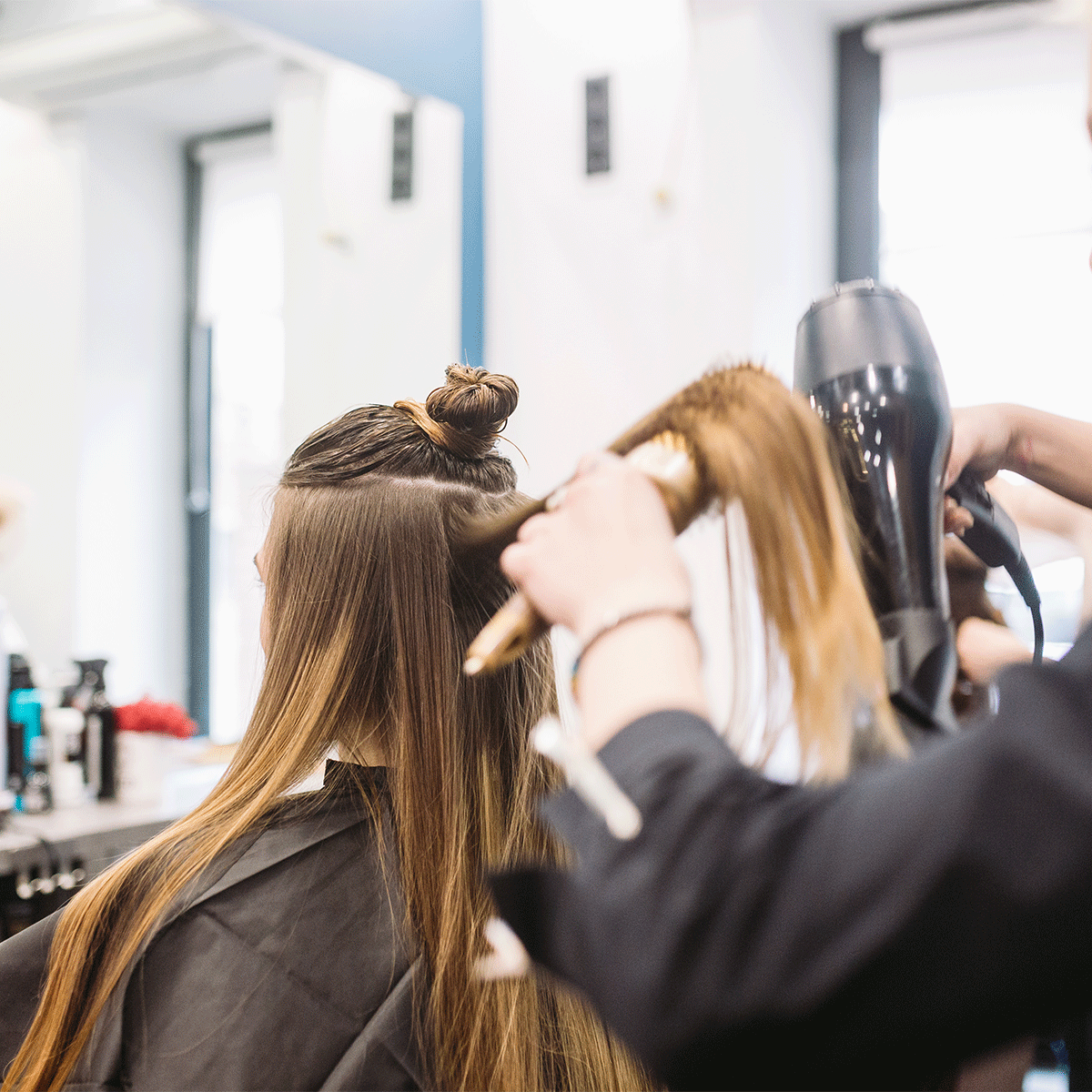 Person getting her hair blow-dried 