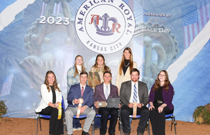 Judging team posing for a picture 5 seated in the front 3 standing behind, 2023 American Royal judging contest