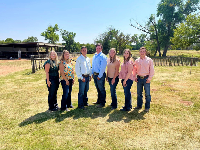 Livestock judging team posing for a picture 7 standing standing on a farm. 2023 Stockman's Sort Leedey, OK & NJSA Southwest Regional Woodward, OK