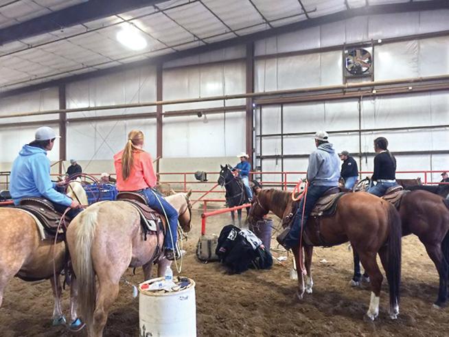 Professional team roper and former Northeastern Junior College rodeo standout Shay Carroll (center), was in Sterling in early November to give a special clinic to the current members of the NJC Rodeo Team.