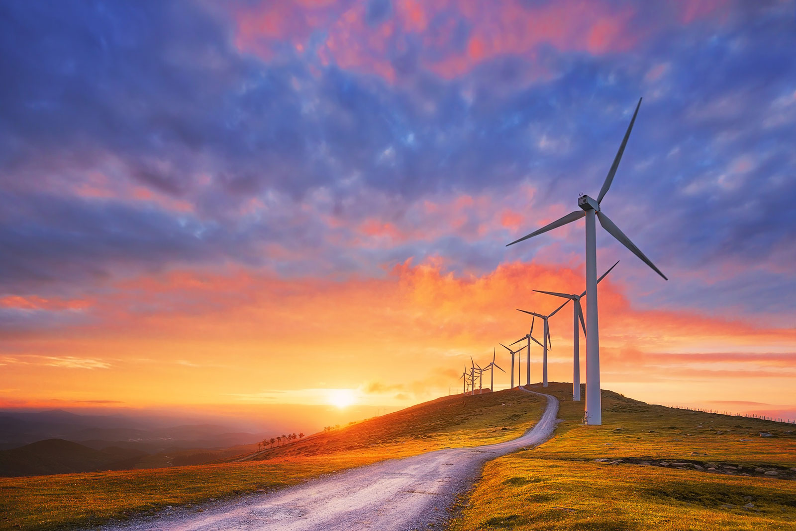 Wind turbines in the plains at sunset