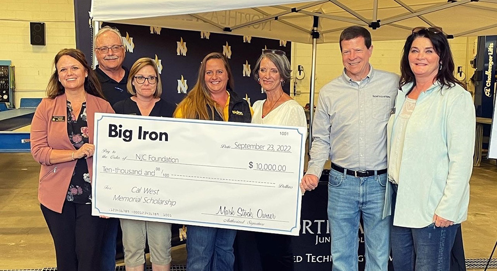 Jennifer Wagner, fourth from left, presented a $10,000 donation to Northeastern Junior College for agriculture and diesel student scholarships on behalf Big Iron in memory of Cal West during a celebration open house for the Applied Technology Campus expansion project Friday, Sept. 23, 2022. 
