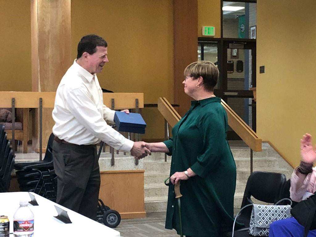Northeastern Junior College President Mike White presents retiring NJC Advisory Council member Karen Ramey-Torres with a retirement gift at the council’s meeting Sept. 21, 2023. Ramey-Torres was on the council for eight years, from 2015 to 2023, serving as chair from 2020-22 and vice chair from 2018 to 2020.