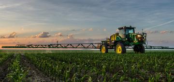 Tractor spraying field