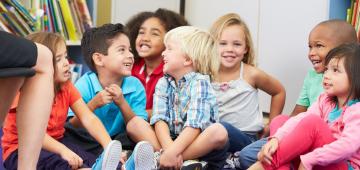 A smiling group of toddlers exemplifies the care and experience Northeaster's early childhood education program provides.