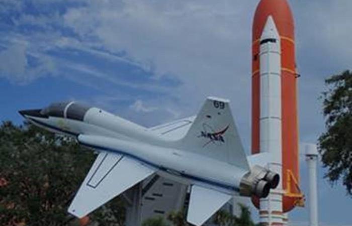 white space shuttle and red and white rocket 