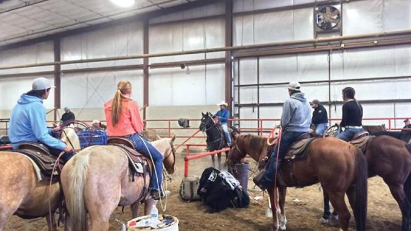 Professional team roper and former Northeastern Junior College rodeo standout Shay Carroll (center), was in Sterling in early November to give a special clinic to the current members of the NJC Rodeo Team.
