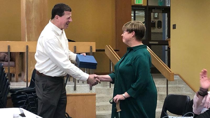 Northeastern Junior College President Mike White presents retiring NJC Advisory Council member Karen Ramey-Torres with a retirement gift at the council’s meeting Sept. 21, 2023. Ramey-Torres was on the council for eight years, from 2015 to 2023, serving as chair from 2020-22 and vice chair from 2018 to 2020.