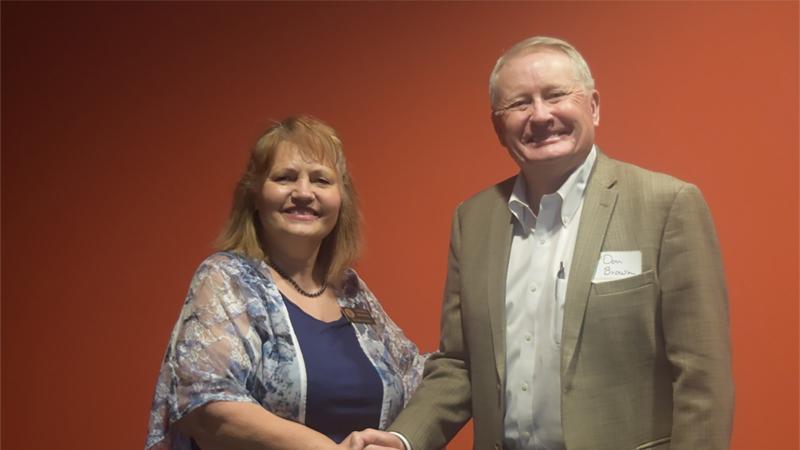 NJC Alumni Association Board Member Laural Brownell congratulates Pathfinder Award recipient Don Brown at the Hoops Homecoming Awards Luncheon Saturday, Feb. 19, 2022. (Callie Jones/Sterling Journal-Advocate) 