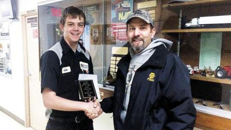 Luke Chartier (shown here on Left) received an engraved plaque and a gift certificate from NAPA’s Aaron Hettinger, who oversees outside sales for the retailer. 