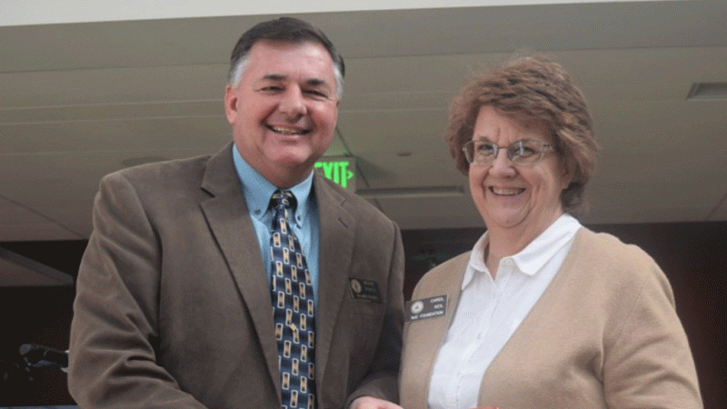 NJC Alumni Association President Mark Kokes presents the Service Award to Carol Keil at the Hoops Homecoming Awards Luncheon Saturday, Feb. 19, 2022. (Callie Jones/Sterling Journal-Advocate)