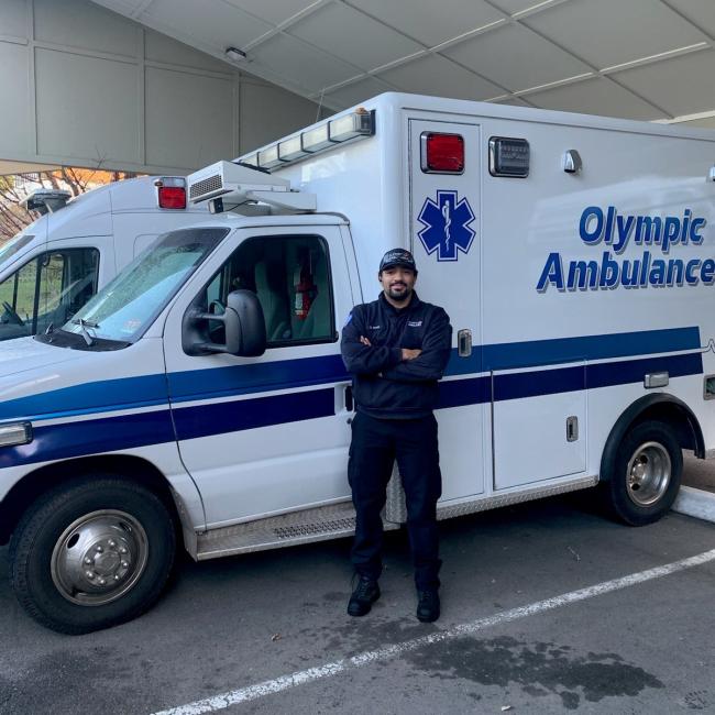 Davon Keyes standing in front of an ambulance 