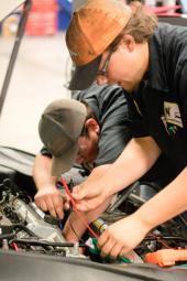 Auto mechanics working together