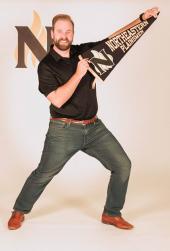 Adam Kunkel with Northeastern penant at Northeastern Junior College's annual Discovery Day. Discovery Day is a prospective student event where students can visit campus, explore majors and meet with current students, faculty, and staff.