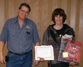 Layton Peterman, (left) professor of automotive technical at NJC and coordinator of the USA Skills District III competition presents Collin Brungardt of Sterling (right) with the second place award.
