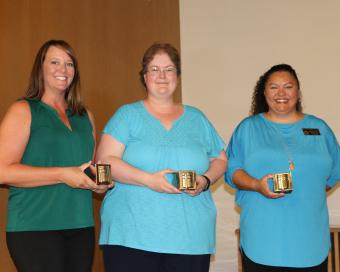 Fifteen-year award recipients, left to right, Amanda Kerker, Cathy Fisher, Celeste Delgado-Pelton