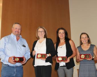 Twenty-year award recipients, left to right, Brian Cullen, Marci Henry, Annie Shalla, Andrea Wasson