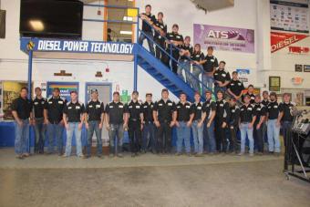 Future diesel mechanics posing on stairs