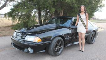 Nicole Fischer, a sophomore from Windsor and the 2016 NJC Auto Show Queen, is shown here posting with Tim Olson's '92 Ford Mustang GT which will be showcased for the first time this year. This unique car only has 5,945 original miles on it.