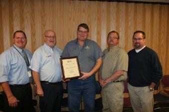 Layton Peterman, head of the automotive technology program at NJC (center, holding plaque) is flanked by some members of the college s automotive program advisory committee who helped oversee the ASE accreditation process including, (from left) Wally Beardsley from RE1 Valley School district, Tim Richie from NAPA Auto and Truck Parts, Peterman, Arlin Dressel of ALD Automotive (Yuma) and Mike Schadegg of Wolf Auto.