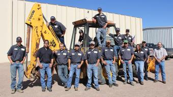 Freshmen students and staff from the diesel technology program at Northeastern are shown here with the JCB1440B backhoe which was recently donated to the program by a family from Breckenridge. The unit will be used as a teaching tool, allowing the students to rebuild what needs to be rebuilt and is especially helpful when learning about how hydraulics work. 