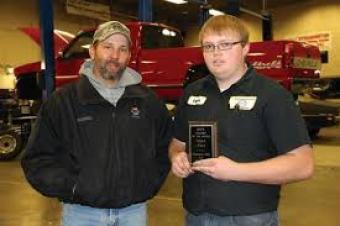 Logan Ward (right) of Atwood, a second year student in the automotive technology program at Northeastern Junior College, has been named the NAPA Student of the Month for November. Presenting the award Aaron Hettinger, outside salesman for the NAPA store. 