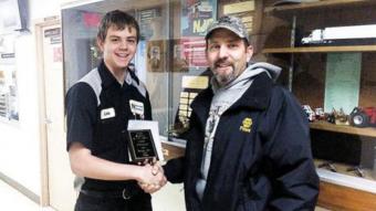 Luke Chartier (shown here on Left) received an engraved plaque and a gift certificate from NAPA’s Aaron Hettinger, who oversees outside sales for the retailer. 