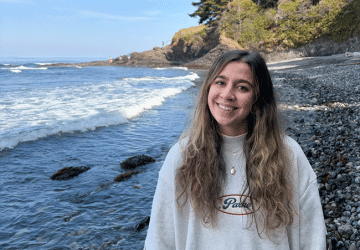 Andie Anderson NJC nursing student standing on a beach in Washington.