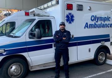 Davon Keyes standing in front of an ambulance 